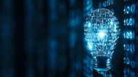 Digital light bulb formed by binary code glowing in blue against dark background with data streams, representing innovation and artificial intelligence.
