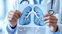 Medical professional holding lung x-ray scan showing detailed bronchial tree structure and airways in blue tones, demonstrating respiratory system anatomy.