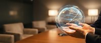 Businessman holding glowing digital globe with network connections in modern office environment for global business and technology concepts.