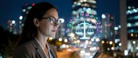 Professional female lawyer with glasses using digital justice interface at night in modern city with glowing legal scales hologram for law technology concepts.