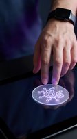 Close-up of male hand with smartwatch touching glowing gear icon on digital interface, representing technology, innovation, and digital transformation for business applications.