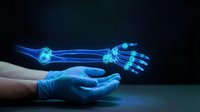 Medical professional in blue gloves presenting holographic arm and hand bones anatomy model for healthcare education and orthopedic diagnosis.