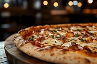 Freshly baked artisan pizza with melted cheese and herbs on wooden board in cozy restaurant setting with warm bokeh lights creating inviting atmosphere.