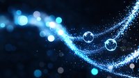 Glowing blue particles and transparent spheres flow in curved motion against dark background creating magical ethereal effect for fantasy designs.