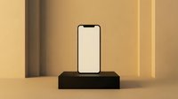 Modern smartphone with blank screen displayed on black rectangular stand against warm beige wall with vertical lighting. Suitable for app mockups, tech presentations, and digital product advertising.
