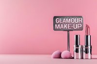 Cosmetic products arrangement with silver lipsticks, pink makeup brushes and glamour sign on pink background. Minimal beauty concept for social media and blogs.