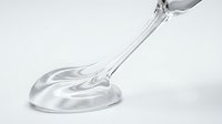 Transparent liquid pouring from spoon onto white surface, creating splash and puddle effect for cosmetics, skincare, and beauty product packaging design.