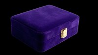 Purple velvet jewelry box with gold clasp, isolated on transparent background. Ready for e-commerce, product mockups, jewelry packaging design, print-on-demand, and digital retail applications.