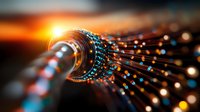 Glowing fiber optic cables transmit data through glass strands with orange light bursts and bokeh effects, showcasing modern telecommunications technology.