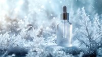 Glass dropper bottle with serum on frosty winter background with ice crystals and frozen branches in blue tones, cosmetic product photography.