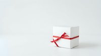 White gift box with red ribbon bow on neutral background, suitable for holiday promotions, e-commerce, and festive marketing materials.