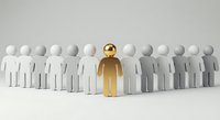 Golden figure standing out among white paper cutout people representing leadership, uniqueness and individual success in business teamwork.