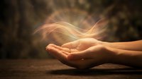 Open hands with glowing energy waves flowing above palms creating mystical light effects for spiritual healing meditation and wellness concepts.