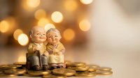 Elderly couple figurines sitting on golden coins with warm bokeh lights background representing retirement savings and financial security planning.