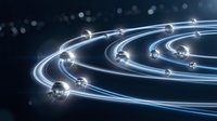 Glowing neon light paths with spheres creating orbital motion effect on dark background, suitable for technology and digital design projects.