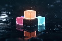 Glowing translucent cubes in pink, orange, and blue arranged on reflective dark surface with bokeh light effects create modern minimalist composition.