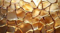Metallic gold cracked surface with honeycomb pattern and light reflections creating abstract geometric shapes and textures for luxury backgrounds.