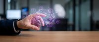 Businessman hand protecting glowing brain with network connections and digital icons in modern office environment for artificial intelligence concepts.