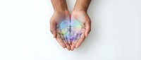Caucasian male hands cupped together holding rainbow light energy, symbolizing hope, healing, and inclusivity for wellness and diversity campaigns.