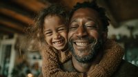 Happy African American father and daughter embracing with joyful smiles in cozy home setting for family bonding moments and parenting concepts.
