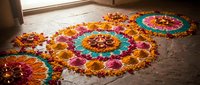 Colorful flower petal rangoli patterns on floor with marigold and rose petals arranged in circular mandala designs for Diwali festival celebration.