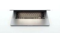 Overhead view of open laptop with illuminated keyboard on white background, isolated for web design and technology marketing use.