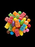 Colorful mixed candy pile with gummy bears, jelly beans, and sugar-coated sweets, isolated on transparent background, ready for stickers, t-shirt design, and print on demand.