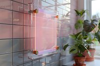 Modern acrylic glass display frame with neon pink backlight mounted on tiled wall near window with decorative houseplants, perfect for interior design and retail showcase presentation.
