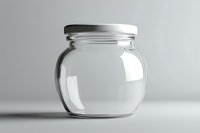 Empty glass jar with white metal lid on light background, minimalist clean composition for food storage and preservation concepts. Isolated product photography.