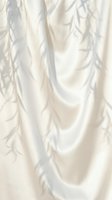 Soft ivory silk fabric with gentle folds and delicate leaf branch shadows creating an elegant, minimal aesthetic for luxury backgrounds.