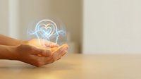 Hands holding glowing heart with pulse line hologram representing healthcare technology, medical innovation, wellness concept for digital health applications.