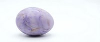 Purple amethyst gemstone with natural crystal formations isolated on white background for jewelry design and spiritual healing applications.