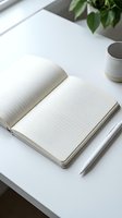 Open lined notebook on white desk with pencil and coffee cup creating minimalist workspace for writing, planning and productivity.