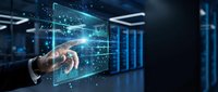 Businessman hand touching digital holographic data visualization with graphs and charts in modern server room environment for technology and analytics concepts.