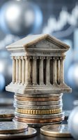 Miniature bank building model standing on stack of coins representing financial institutions, banking services, investment and monetary system concepts.