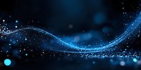 Glowing blue wave of light particles flowing on dark background with bokeh effect and sparkles creating magical atmosphere.