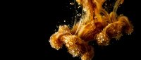 Golden orange jellyfish floating gracefully in dark water with sparkling bubbles and ethereal lighting creating magical underwater marine life scene.