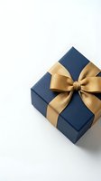 Navy blue gift box with elegant gold satin ribbon bow on white background, luxury present for holiday, birthday, or corporate celebration.