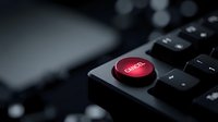 Red cancel button on black computer keyboard with selective focus for business and technology concepts.