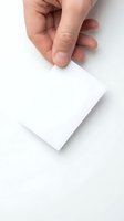 Hand holding blank white card isolated on white background, suitable for business card mockups, branding presentations, and corporate design templates.