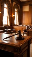 Wooden gavel on judge desk in elegant courtroom with leather chairs and arched windows for legal proceedings and justice concepts.