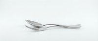 Two stainless steel spoons crossed together on a white background, isolated cutlery set with sleek modern design for kitchen and dining concepts.