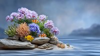 Vibrant underwater scene with pink chrysanthemums, blue hydrangea, coral formations, and clownfish on rocky ledge against misty ocean backdrop.