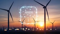 Wind turbines at sunset with digital innovation network overlay representing sustainable energy technology and smart grid connectivity.