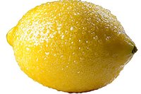 Fresh ripe yellow lemon with water drops on white background, macro shot showing detailed citrus fruit texture and natural moisture on peel surface.