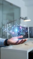 Businessman hand holding futuristic digital network with glowing connections and technology icons in modern office environment for innovation concepts.