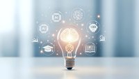 Glowing light bulb with artificial intelligence and technology icons floating around it on modern blurred background for innovation concepts.