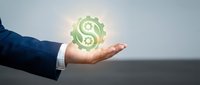 Businessman hand holding glowing dollar sign symbol, representing financial success, money management, and business growth opportunities for corporate finance concepts.