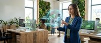 Professional businesswoman interacting with holographic environmental technology display in modern sustainable office workspace for green innovation.