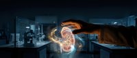 Hand holding glowing holographic kidney model in modern medical laboratory for healthcare technology and organ transplant research applications.